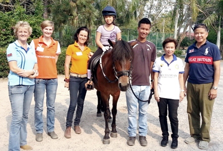 (L to R) Sandra Cooper (riding therapist), Charlotte Weber, riding coach and instructor, Angela Navaraj, riding coach and instructor, Herb riding Tiffi, Akkasit Tiatrakul, riding coach and instructor (SEA Games gold medalist for Thailand), Vaewratt Kamonkon (owner of Horse Lovers Club Bangkok), and Suvich Prechaharn (father of Herb).