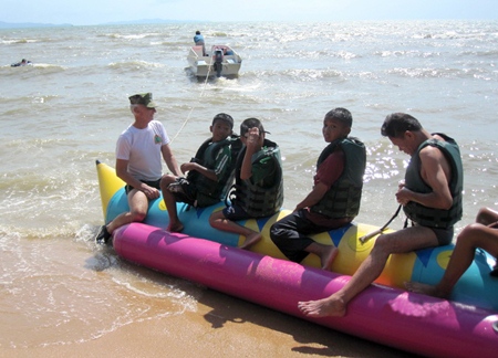 Rad Mays from Young Marines Pattaya and Buriram school kids taking the last banana boat ride for the day.