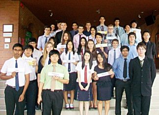 Students hold up their represented countries.