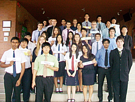 Students hold up their represented countries.