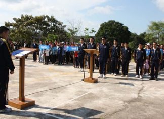 Rear Adm. Trasit Phanthusit (left) addresses students and coaches on the Royal Thai Navy’s Anti-Drug Sports Day.
