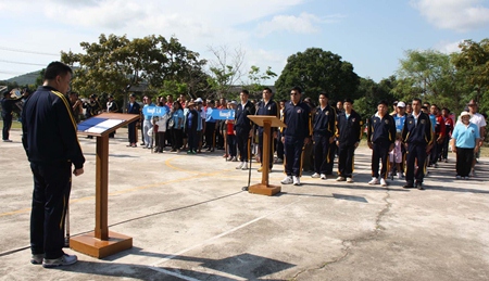 Rear Adm. Trasit Phanthusit (left) addresses students and coaches on the Royal Thai Navy’s Anti-Drug Sports Day.