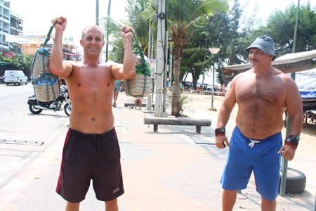 Kostya (left) showing the weight training equipment made by Andrey (right).