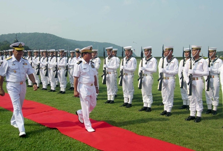 Myanmar’s top naval commander, Rear Adm. Tulataed Chuay walks the red carpet to inspect a Thai Marine Corps honor guard of 100 sailors.