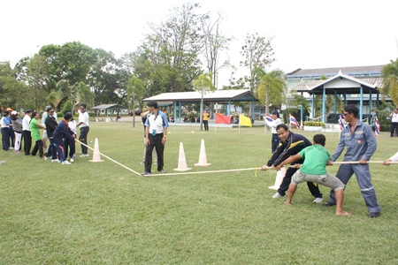 Even though it’s a sports day for the students, the adults can’t help but get involved with a tug-o-war.