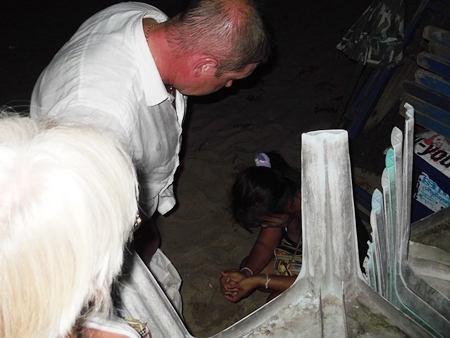 Oops!  Caught in the act, and on the beach right in front of Pattaya Police Station no less.