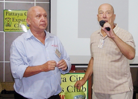 PCEC Board member Roy (R) and newest member Larry draw the winner of the raffle to provide PCEC with some new sound equipment.