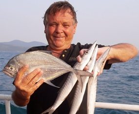 Dave, an occasional visitor from UK, with some of his catch.