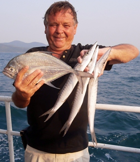 Dave, an occasional visitor from UK, with some of his catch.