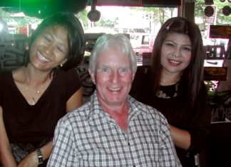 Geoff Stubbs (center) poses with staff at the Beaver Bar & Grill.