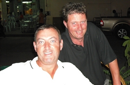 Mike Lloyd (front) gets some tips on how to lose less balls, from visiting teaching pro Keith Smithson.