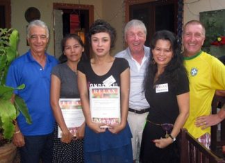 Tuesday’s winners pose with staff members at The Relax Bar.