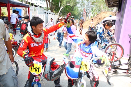 Senior and junior riders give encouragement to one another.