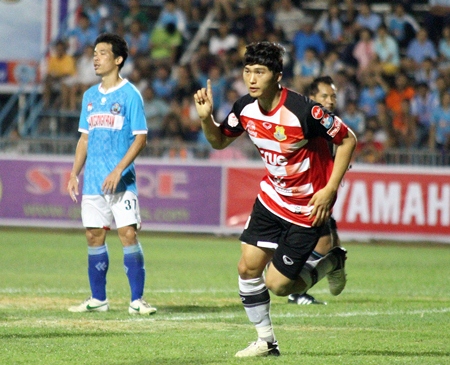 Jung Ji-Soo celebrates scoring for Pattaya United against Samut Songkhram FC during their opening Thai Premier League match, Saturday, March 2.