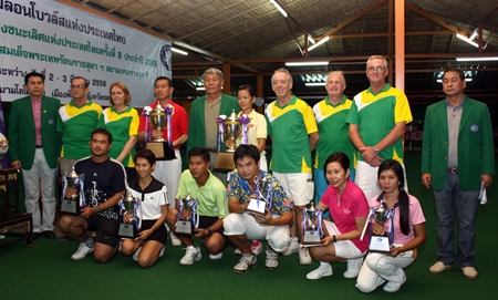 Winners pose with their trophies alongside organizers and officials at the Thailand Lawn Bowls National Singles tournament held at Coco Club Resort, Pattaya, Sunday, March 3.