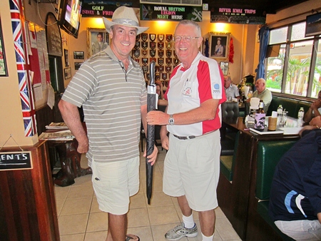 Dick Warberg (right) presents the MBMG Group Golfer of the Month award to Mike Gaussa.