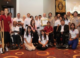 Brother Denis Gervais C.Ss.R. (holding certificate), vice president of the Father Ray Foundation receives a posthumous award on behalf of the late Father Raymond Brennan from Mayor Itthiphol Kunplome (right). The late Father Ray Brennan, an American Redemptorist priest who founded several social projects for underprivileged children and students with disabilities, was an outstanding citizen of the city. Also in attendance were Father Peter Pattarapong Srivorakul C.Ss.R. (left), and Father Michael Picharn Jaiseri C.Ss.R. (second left), president and vice president of the Father Ray Foundation respectively. Father Ray passed away in 2003 and since then the Father Ray Foundation has continued his work and currently cares for more than 850 needy children, blind students and young adults with disabilities.
