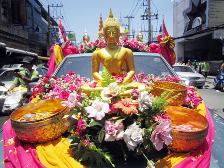 Lord Buddha looks completely at peace during the flower parade.