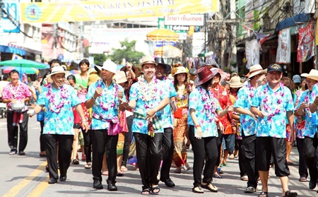 Mayor Itthiphol Kunplome leads council members in dancing traditional dance whilst leading the parade around Naklua market.