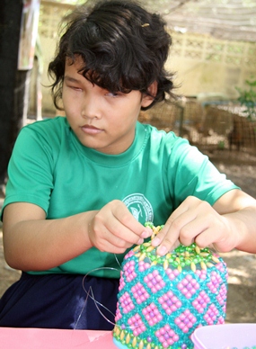 The blind students showed their beading skills.