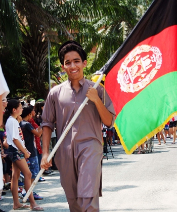 This young man proudly represents his home, Afghanistan, in the Parade of Nations.