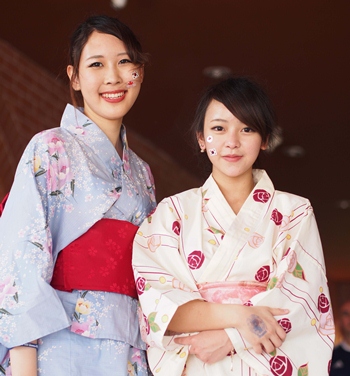 Beautiful young women proudly wear traditional Japanese clothing.