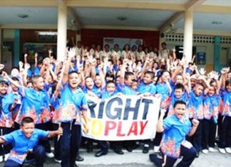 Students from Prayaprasert School, Bangkok participate in a play day reflecting the theme of teamwork and unity.