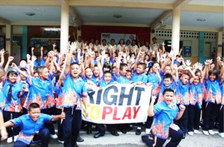Students from Prayaprasert School, Bangkok participate in a play day reflecting the theme of teamwork and unity.