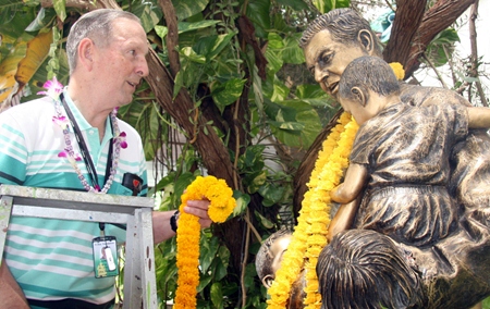 Brother Denis was the first to wash the statue of Father Ray.