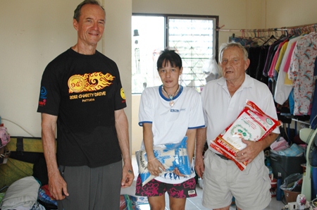 Woody and Bernie present rice presented to Nong Ice’s mum.