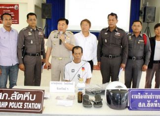 Police bring out Suphot Photthip to face multiple charges, including murder.