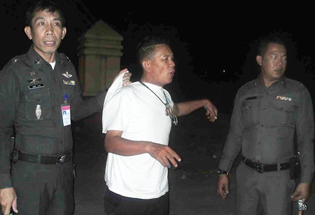 Chaiyon Chaodon (white t-shirt) denies the charges; nonetheless, police confiscated the handgun (lower right) that witnesses claimed he brandished in a fit of road rage.