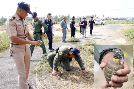 The Royal Thai Navy’s bomb squad begins the process of defusing an unexploded World War II hand grenade (inset).