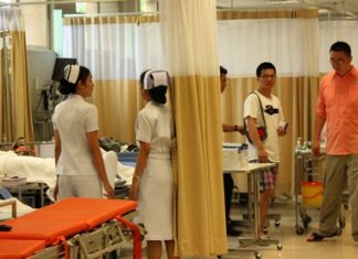 Chinese tourists are administered to at Bangkok Hospital Pattaya after many received what is believed to be food poisoning at an unnamed restaurant on Koh Larn.