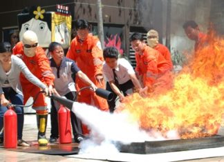 Employees at the mall are taught how to use fire extinguishers during Central Festival Pattaya Beach’s quarterly fire drill.