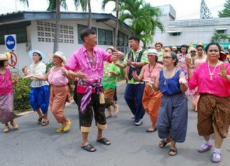 Old in years but young in heart, folks from Apakorn Kiatwong Hospital dance in the Thai New Year.