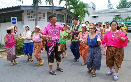 Old in years but young in heart, folks from Apakorn Kiatwong Hospital dance in the Thai New Year.
