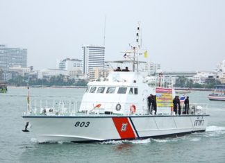 A Coast Guard vessel leads a parade of marine safety boats during the announcement of increased cooperation between marine police, marine departments, city hall, Sawang Boriboon and marine volunteers.