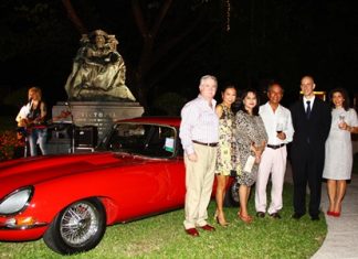 British Ambassador to Thailand Mark Kent (2nd right) joins friends around the centerpiece of the party: a classic E-Type Jaguar.