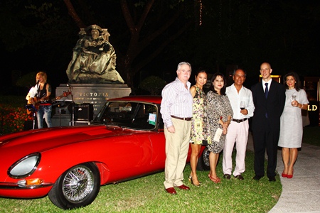 British Ambassador to Thailand Mark Kent (2nd right) joins friends around the centerpiece of the party: a classic E-Type Jaguar.