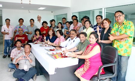 Marlowe and Peter Malhotra (seated, 2nd & 3rd right) lead the Pattaya Mail “family” in traditional Songkran blessings.