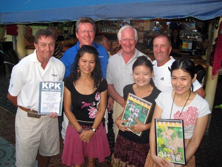 Tuesday’s winners pose with staff at The Relax Bar.