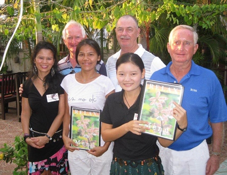 Tuesday’s winners pose with staff at The Relax Bar.