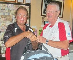 Dick Warberg (right) congratulates Andre Van Dyk, the winner of The MBMG Golfer Of The Month award.