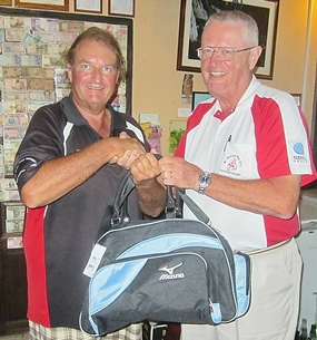 Dick Warberg (right) congratulates Andre Van Dyk, the winner of The MBMG Golfer Of The Month award.
