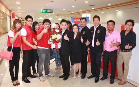 Management, staff and local officials gather for the grand opening of Air Asia’s customer service center at the Tesco-Lotus mall in South Pattaya.