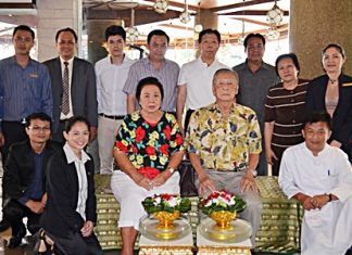 Somchai Ratanaopath (rear 4th left), Chairman of the Board, and Somkiet Ratanaopath (rear 4th right) standing), Managing Director of the A-One The Royal Cruise Hotel Pattaya gathered together his management and staff to pay their respects to Mitr Ratanaopath and Wantana Ratanaopath (seated) founders and owners of the hotel.
