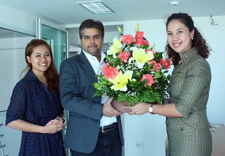 Usa Pookpant (right), public relations manager, and Naruechon Petlek (left), public relations executive of the Centara Grand Mirage Beach Resort Pattaya paid a courtesy call on the Pattaya Mail offices to congratulate Suwanthep Malhotra on his appointment as president of Skål International Pattaya & East Thailand recently.