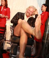 Sir Richard shaves his legs, if not his chin.