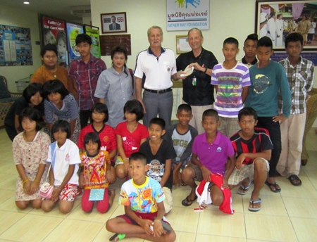 Father Dennis accepts the money from PSC.